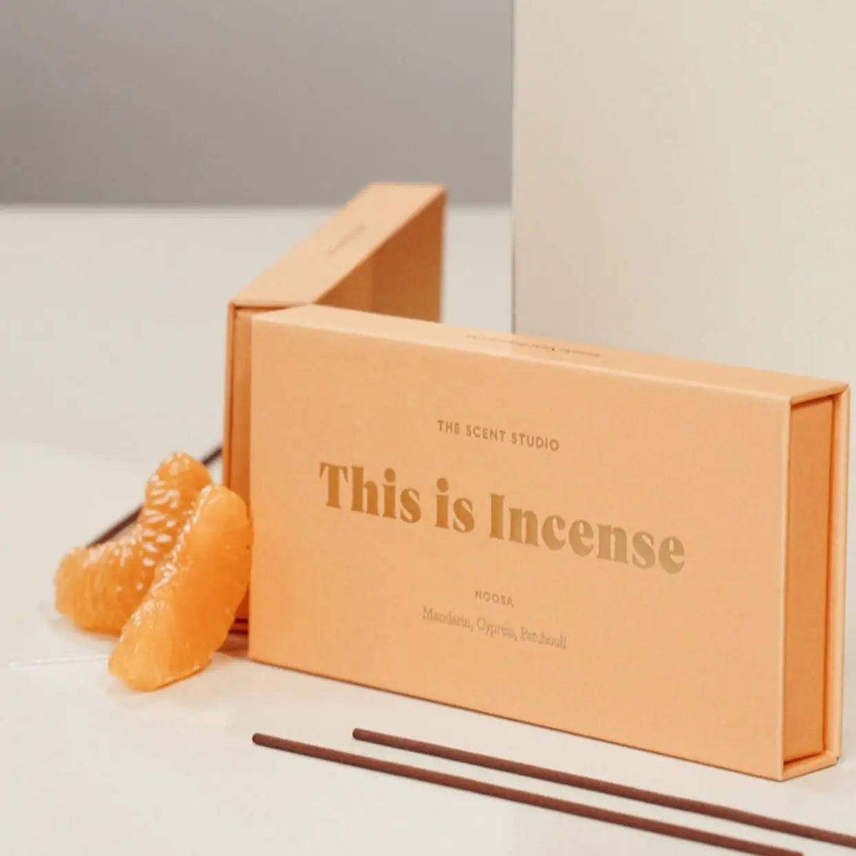 Noosa orange incense box with opened sticks displayed