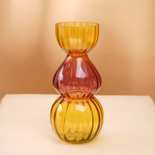 “Side view gleaming bubble vase amber tone contemporary décor"
