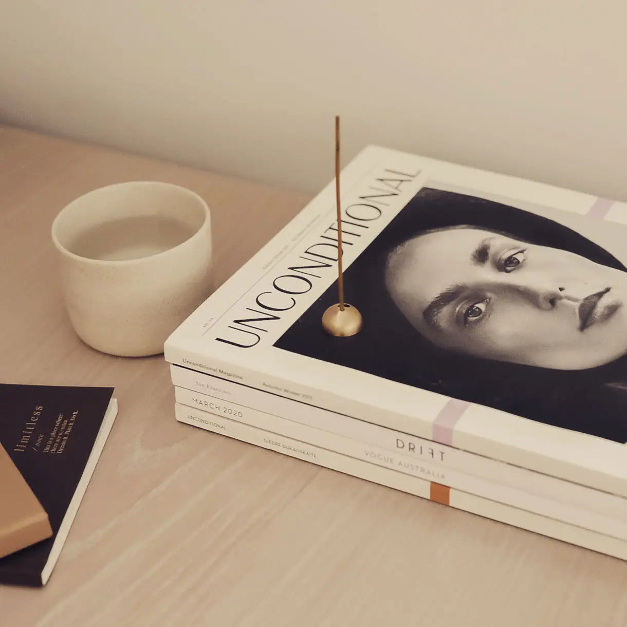 Noosa incense box styled with fashion magazine and decor