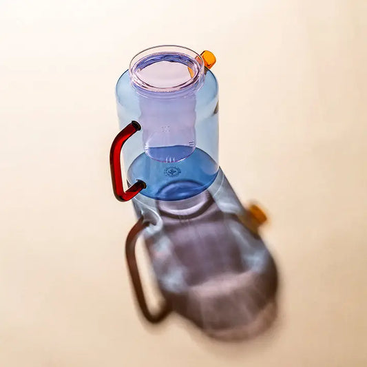 Twilight glass teapot with orange handle – front view
