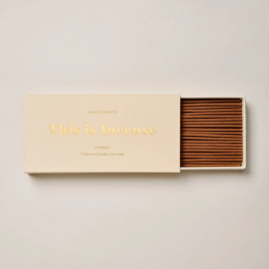 “Connect incense box in cream color shown partially opened with incense sticks”