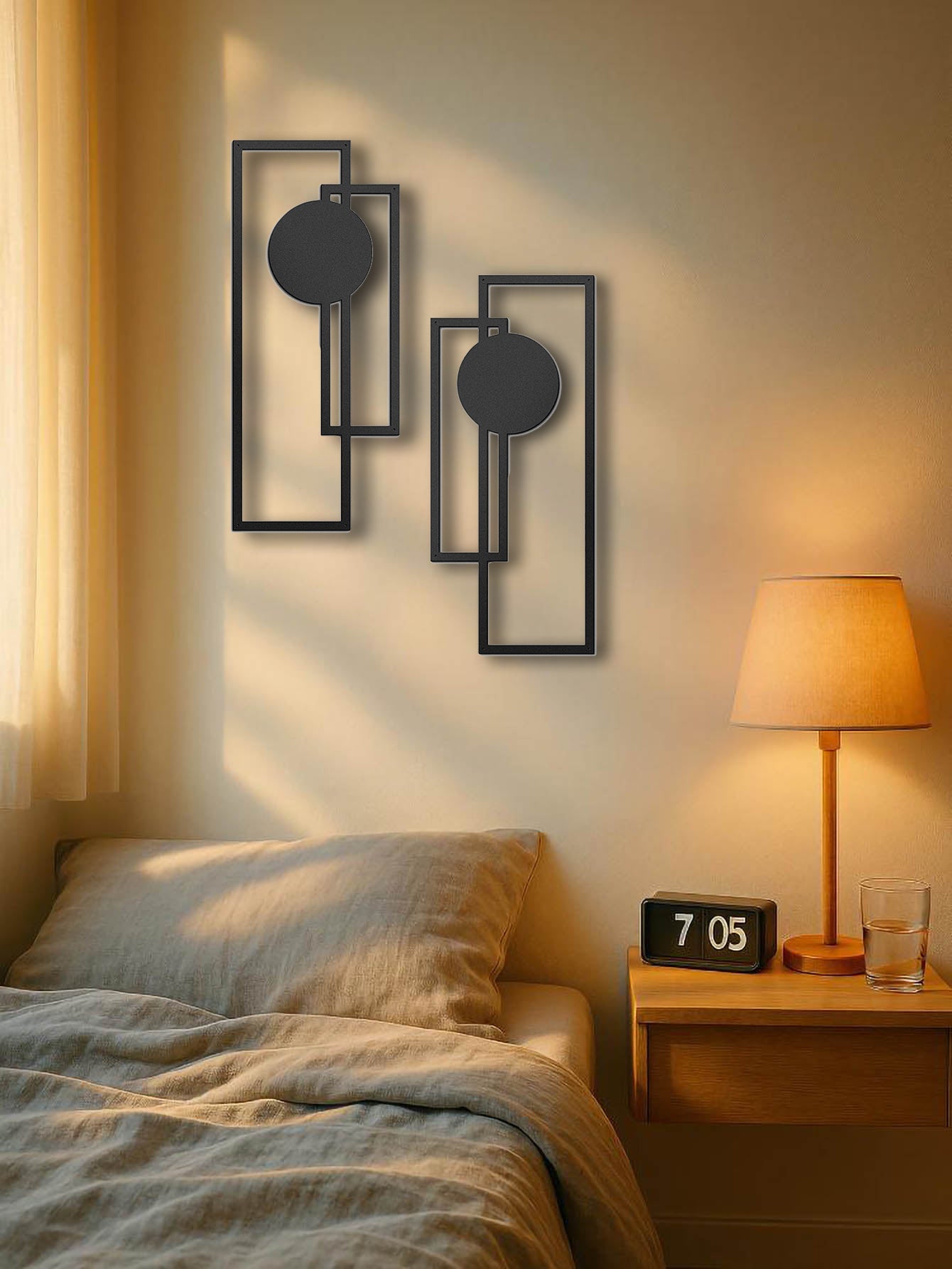 minimalist black metal wall art set above bedside table with warm lamp